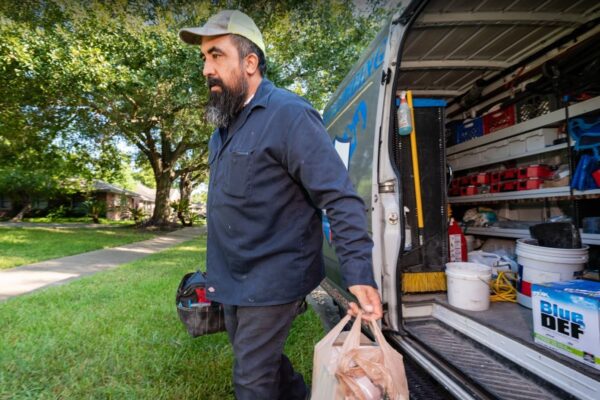 Texas Premier Plumbing technician working on an urgent plumbing repair at a Houston home