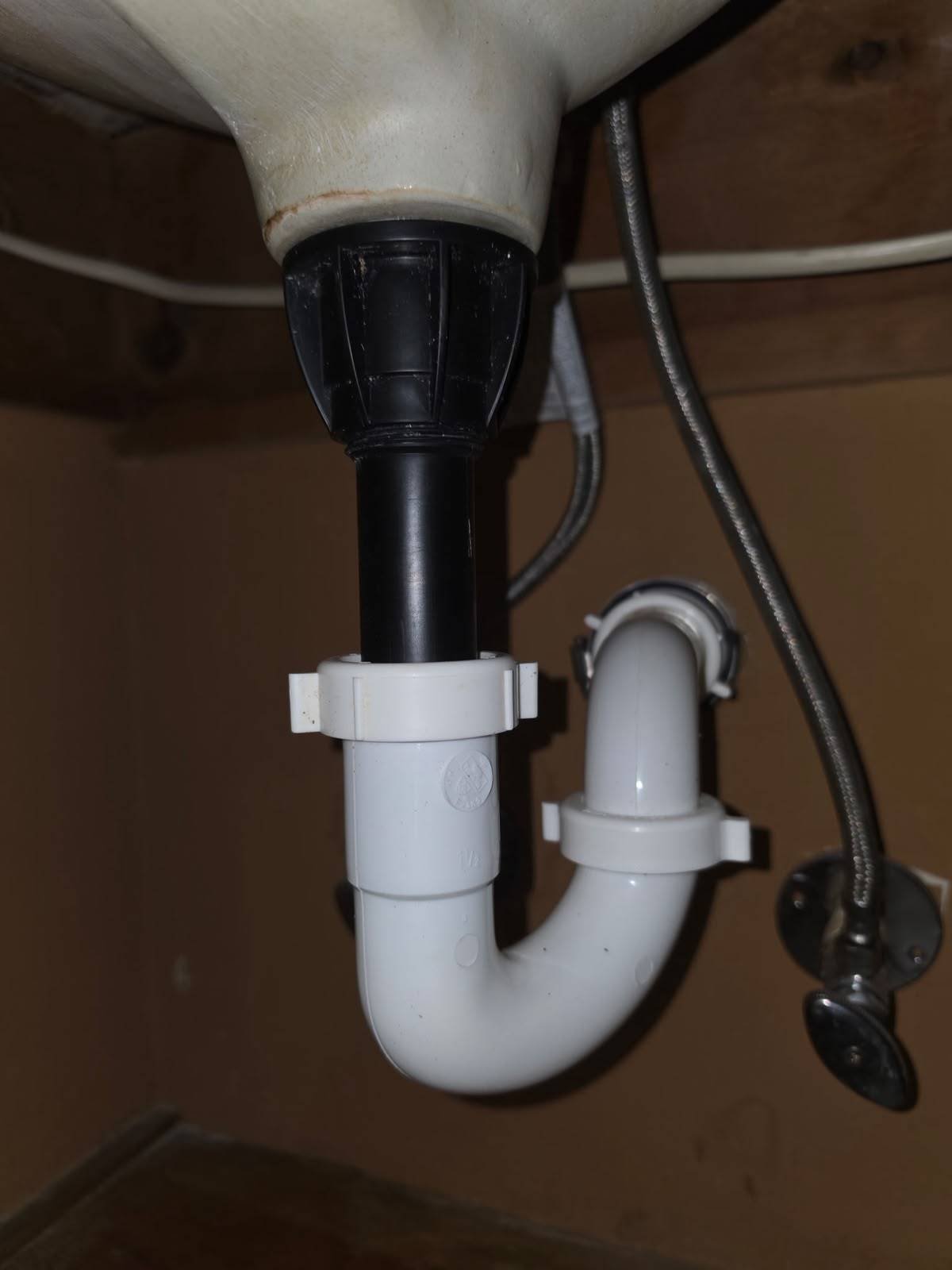 New PVC P-trap installed under a bathroom sink in Katy TX 77450