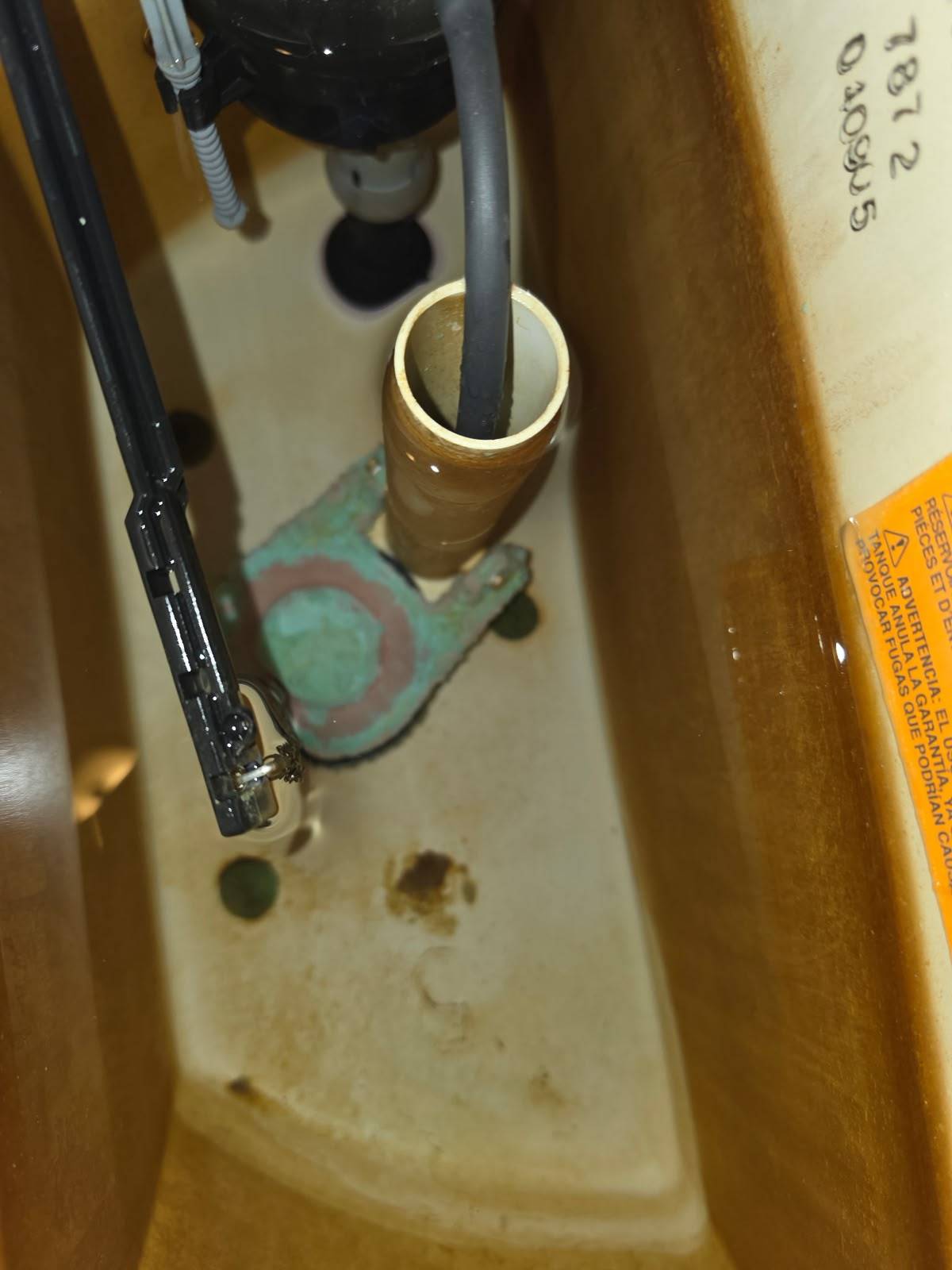 Corroded toilet flush valve before a tank rebuild in Bellaire TX 77401